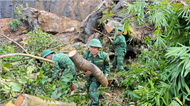 Military and militia forces assist residents in disaster recovery efforts